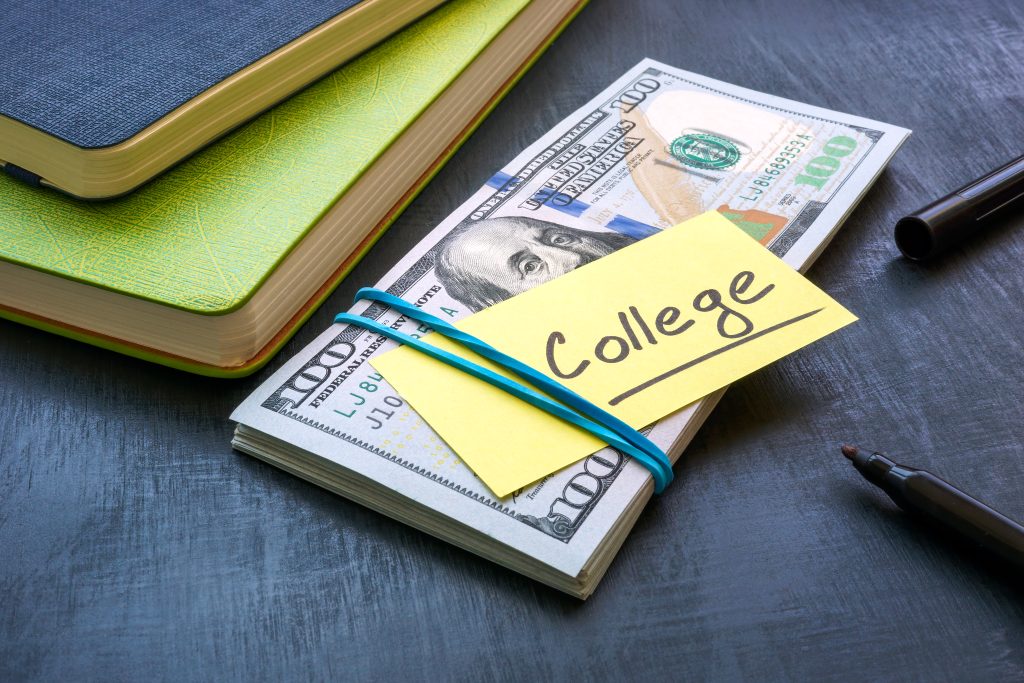Bundle of money with the inscription college. Tuition payment concept.