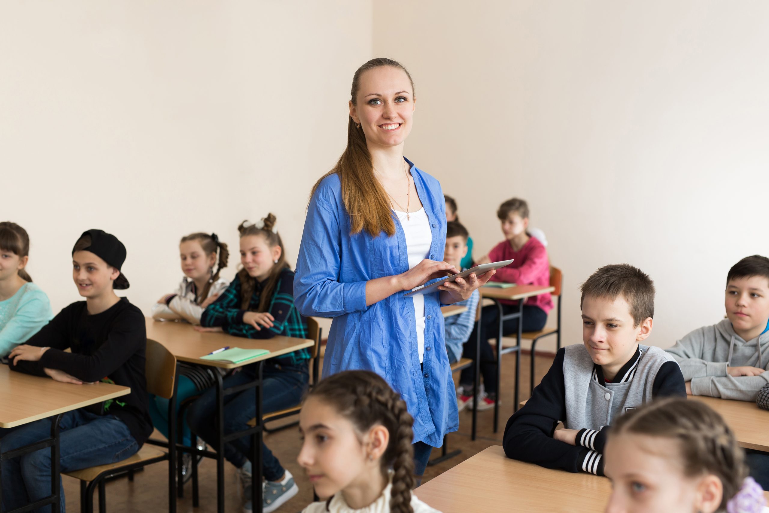 Pretty teacher smiling at camera