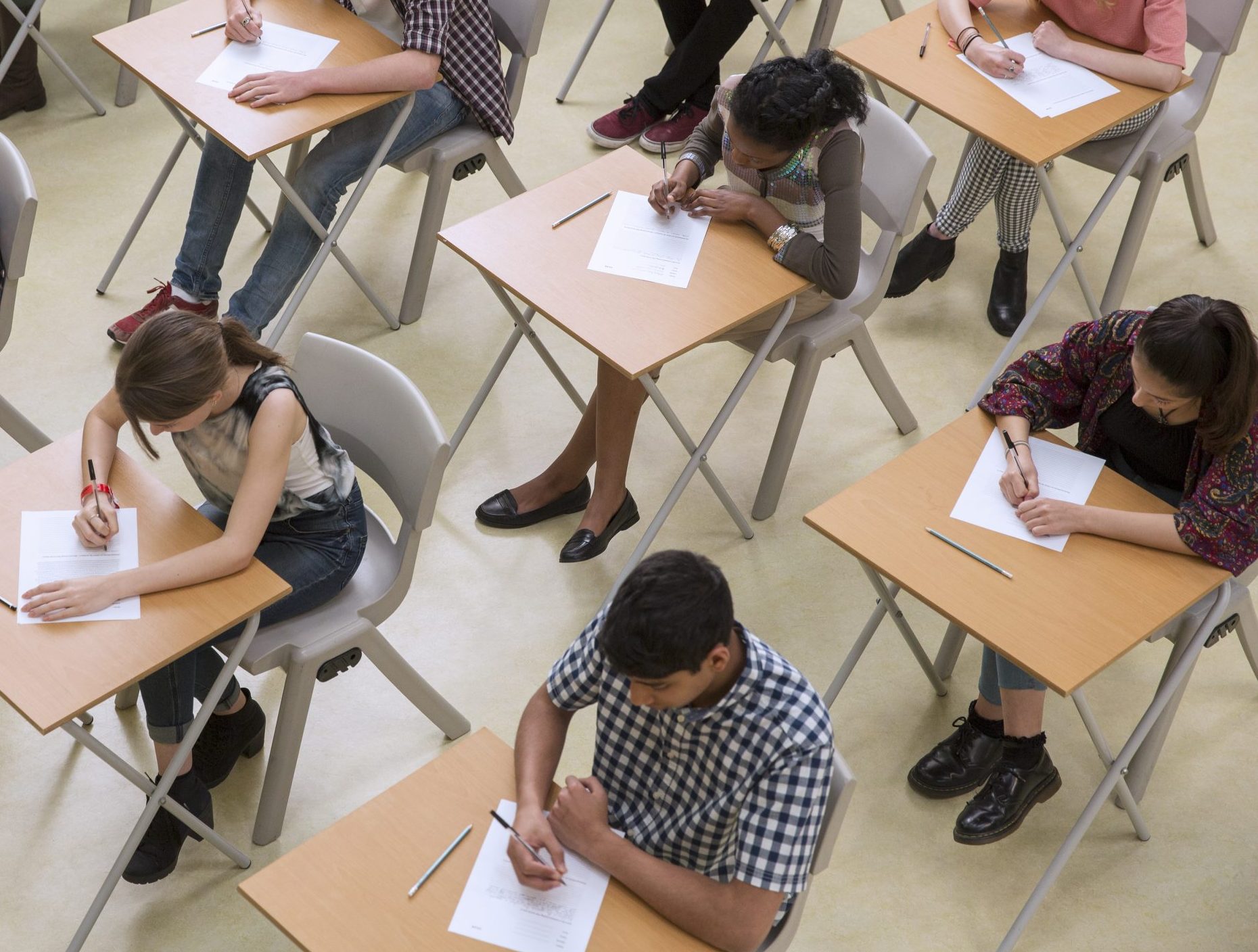 Elevated view of students writing their GCSE exam