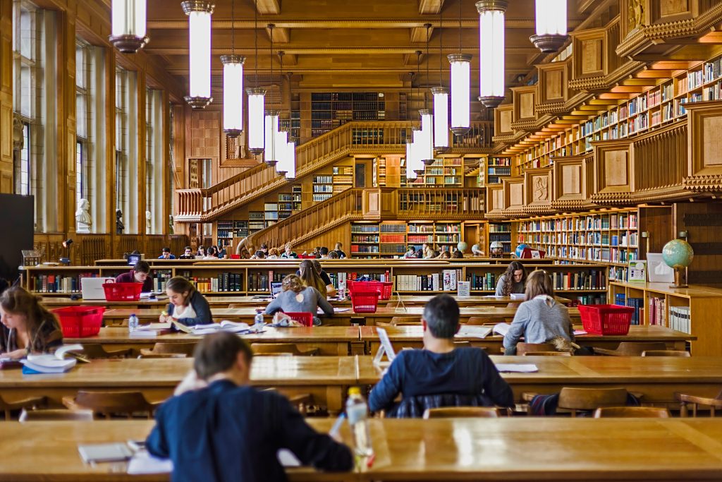 Leuven, Belgium - October 14, 2015: Students who studying inside the library of the university of Leuven, Belgium, old from the years 1425.